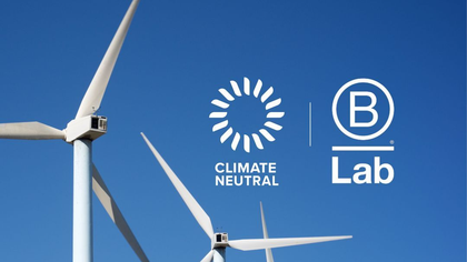 Climate Neutral and B Lab logos with windmill background